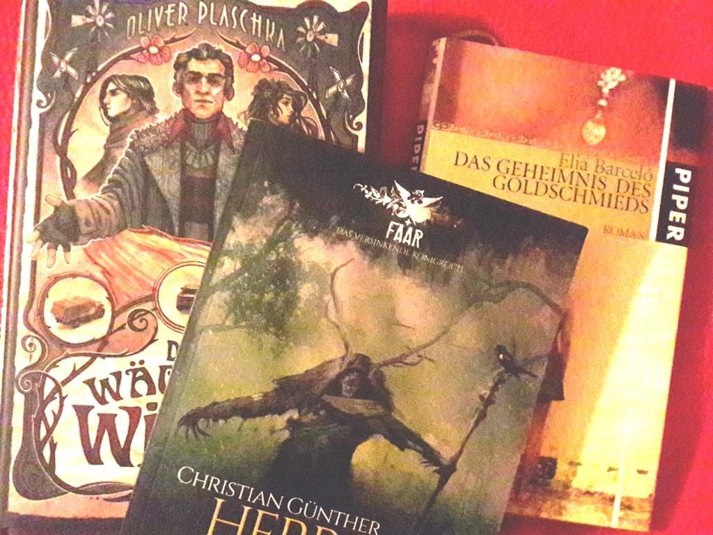 Foto mit Büchern zu "Der Wächter der Winde", "Herr der Wälder" und "Das Geheimnis des Goldschmieds"